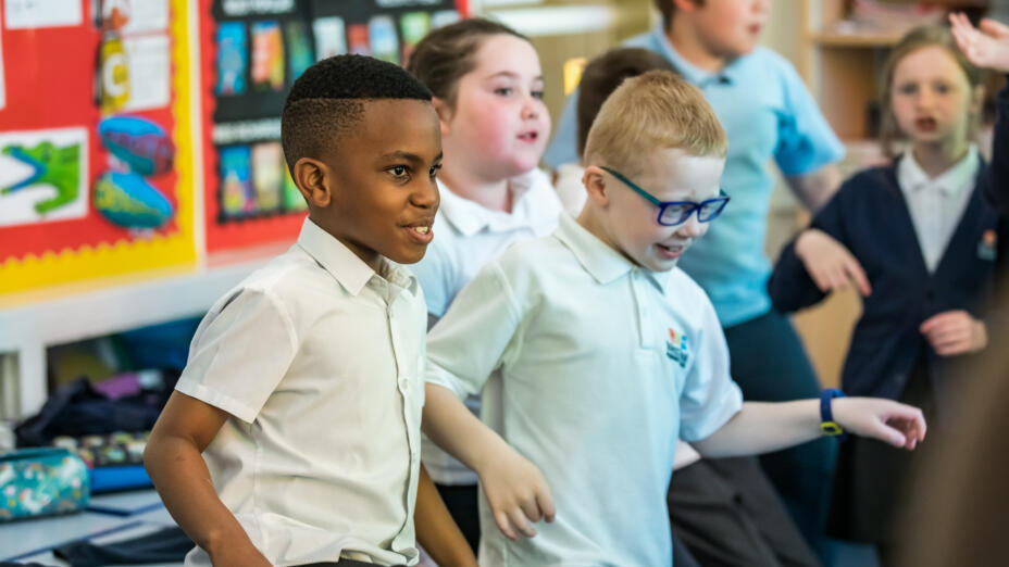 Two young boys take part in an arts-based learning session